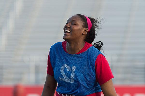 UIW Intramural Student Smiling while playing flag football